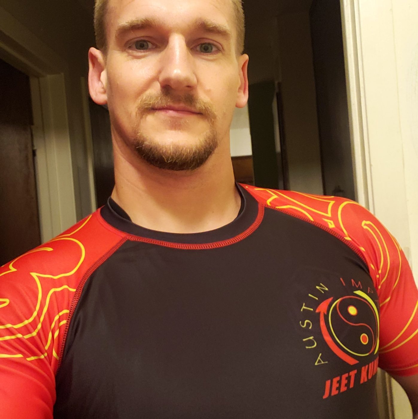 Coach Forrest wearing an Austin Impact JKD training shirt